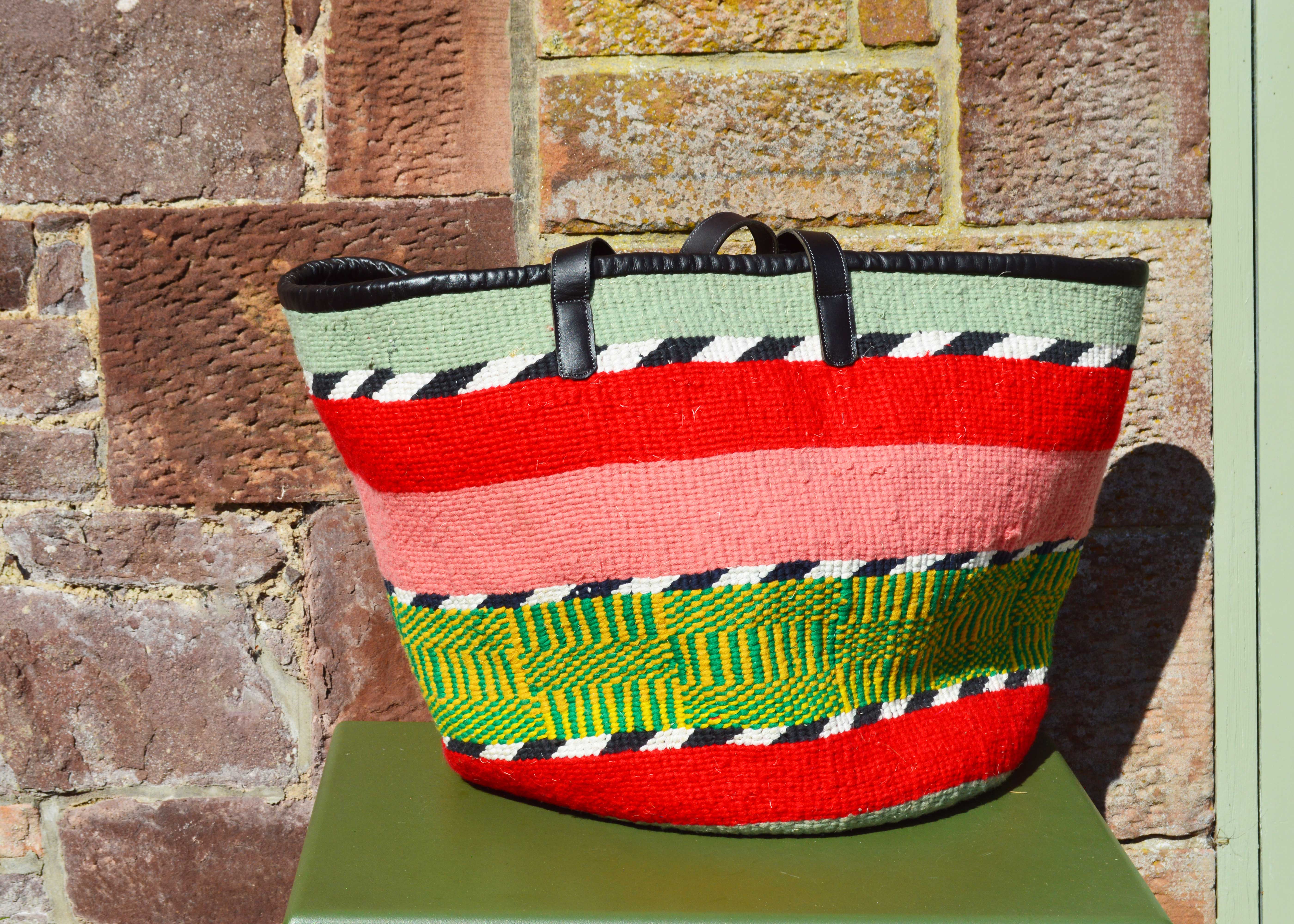 Giant Woollen Kiondo Style Lined Basket with heavy duty Mocha leather trim & handles. Light Green, Red, Pink, Green and Yellow Patterned Hoops